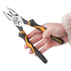 Close-up of hand holding Tolsen high leverage lineman's pliers